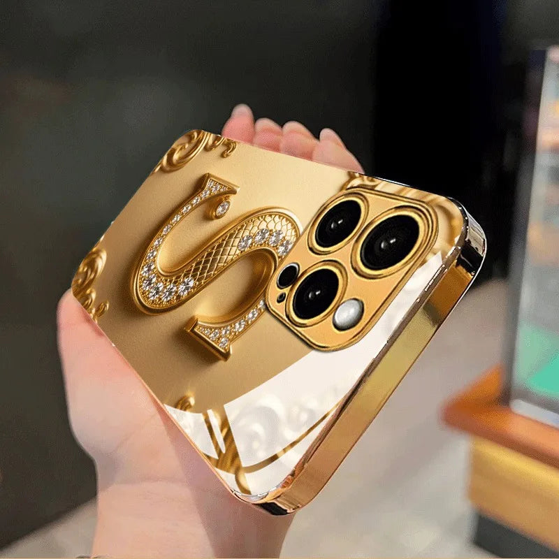 Luxury Golden “S” Pattern Metallic Glass iPhone Case – Shockproof Hard Cover for iPhone 17/16/15/14/13/12 Pro Max Plus